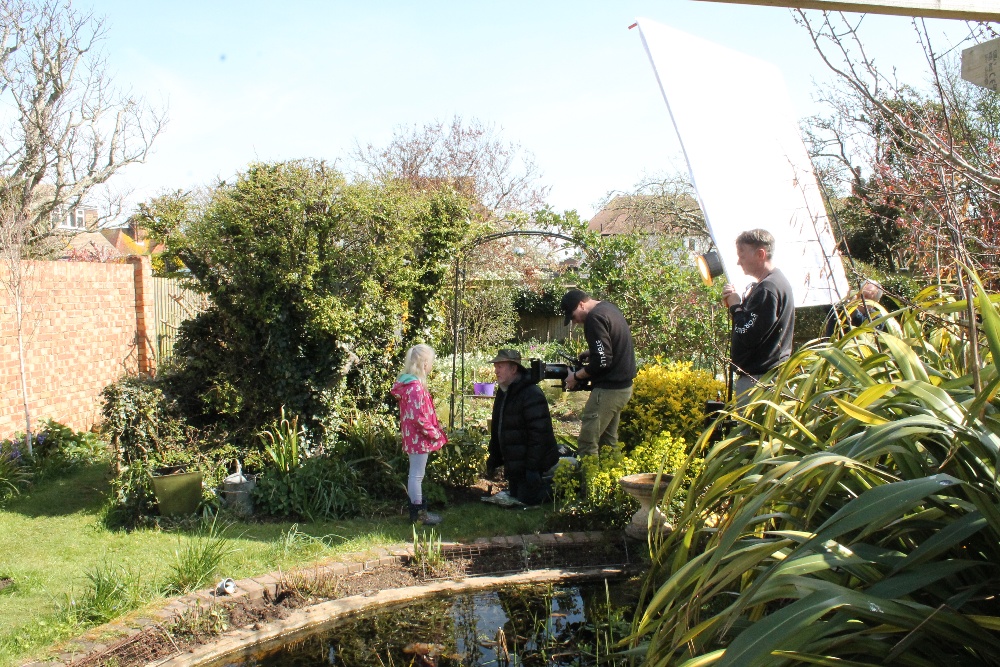 the film crew filming isabella and nick by the pond with tadpoles